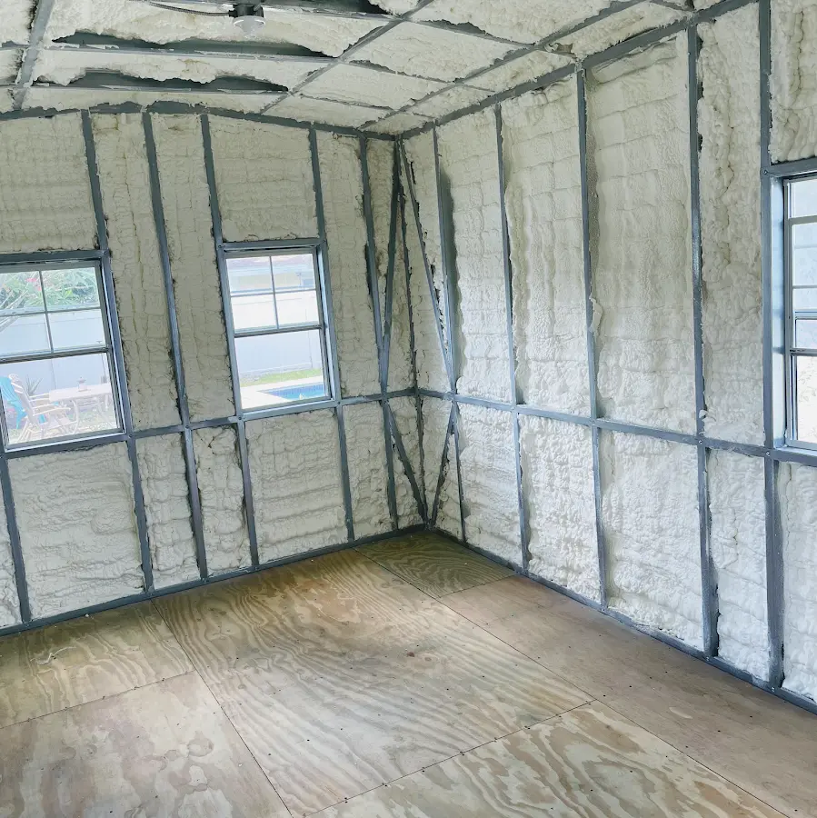 Closed-cell spray foam insulation applied to wall cavities in a residential project in Mattoon